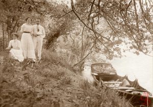 Stanley and friends with boat by the river