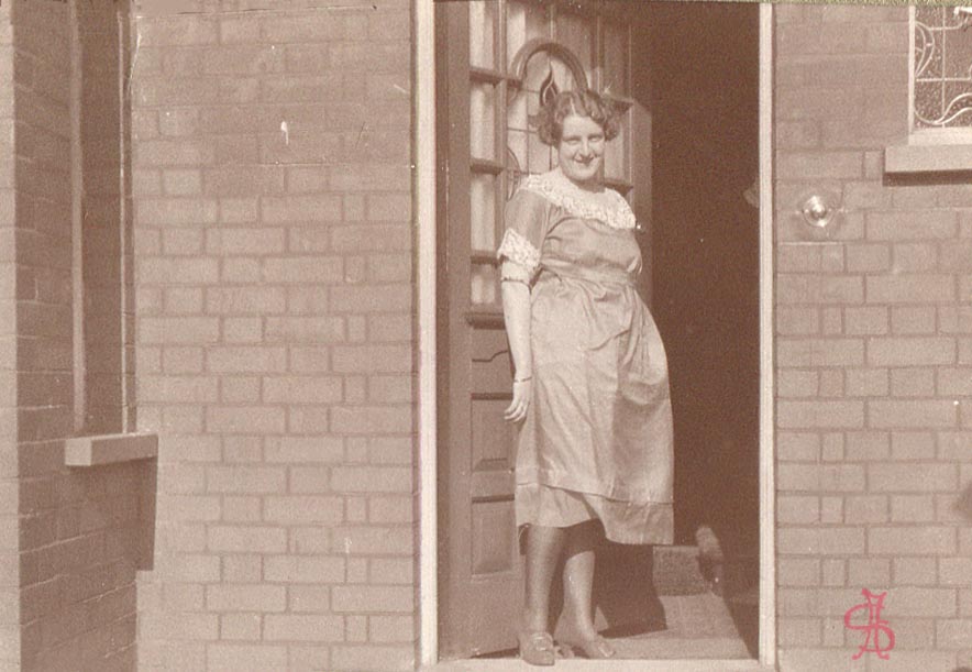 Madelaine Jackson in doorway to 121 Harrow View