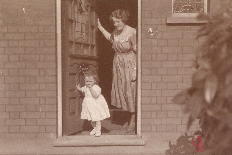 Jean Wild and Madelaine Jackson in doorway of 121 Harrow View