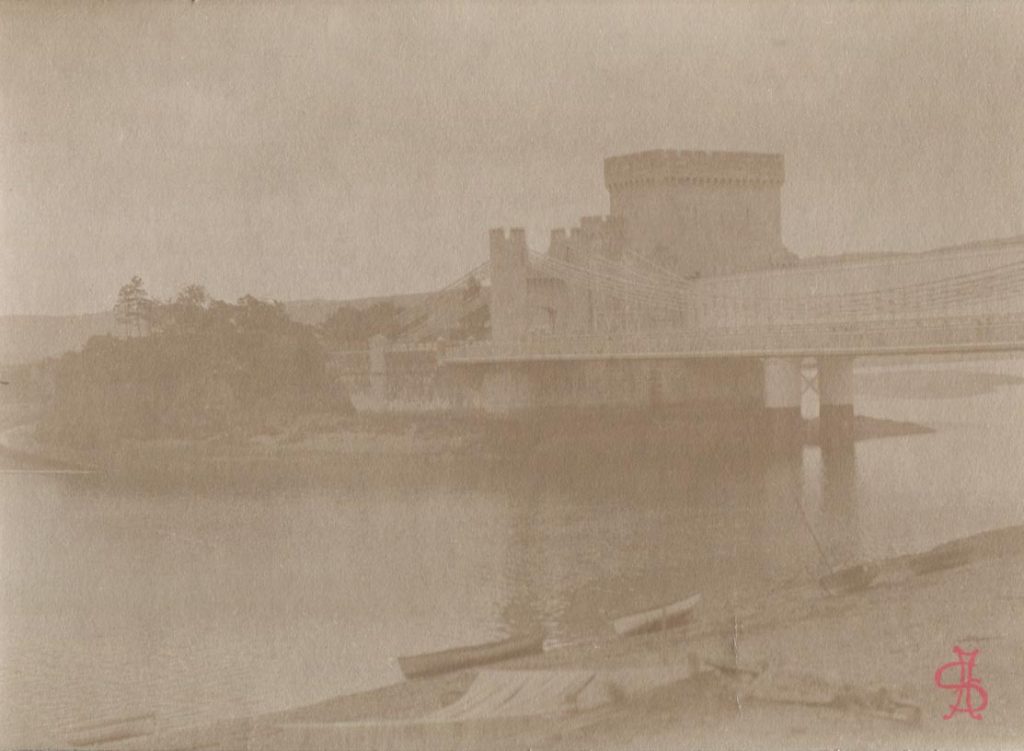 Conwy suspension bridge with railway bridge behind